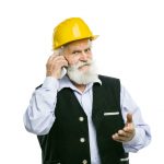 Senior manual worker with mobile phone isolated